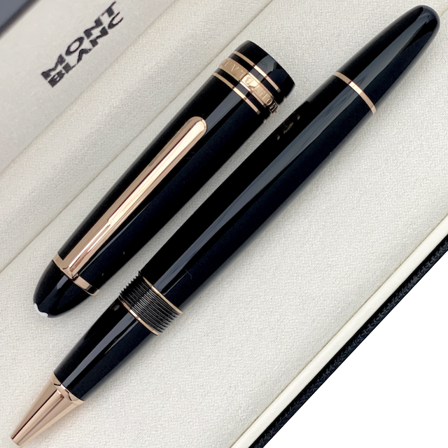 schwarzer Montblanc Rollerball mit rot vergoldeten Beschlägen in Box liegend